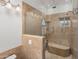 Large walk-in shower with glass enclosure and built-in seat at 9377 E Corrine Dr, Scottsdale, AZ 85260