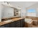 Bathroom features granite countertops and soaking tub at 9377 E Corrine Dr, Scottsdale, AZ 85260