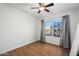 Light and airy bedroom featuring wood flooring and a ceiling fan at 9377 E Corrine Dr, Scottsdale, AZ 85260