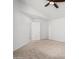 Simple bedroom with ceiling fan and gray carpet at 9377 E Corrine Dr, Scottsdale, AZ 85260