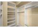 Spacious closet with built in shelving and hanging rods at 9377 E Corrine Dr, Scottsdale, AZ 85260