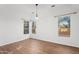 Simple dining area with hardwood floors and large windows at 9377 E Corrine Dr, Scottsdale, AZ 85260