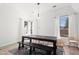 Dining room with hardwood floors and a farmhouse table at 9377 E Corrine Dr, Scottsdale, AZ 85260