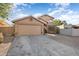 Two-story house with tan exterior, double garage, and landscaped front yard at 9377 E Corrine Dr, Scottsdale, AZ 85260