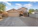 Two-story house with tan exterior, double garage, and landscaped front yard at 9377 E Corrine Dr, Scottsdale, AZ 85260