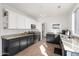 Modern kitchen with granite counters, stainless steel appliances, and dark wood cabinets at 9377 E Corrine Dr, Scottsdale, AZ 85260