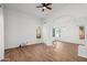 Bright and airy living room with hardwood floors and large windows at 9377 E Corrine Dr, Scottsdale, AZ 85260