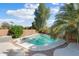 Relaxing kidney shaped pool with a concrete deck and landscaping at 9377 E Corrine Dr, Scottsdale, AZ 85260