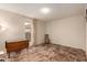 Bright bedroom featuring tile floors and a wood drop-leaf table at 9734 N 105Th Dr, Sun City, AZ 85351