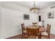 Cozy dining area with round table and four chairs at 9734 N 105Th Dr, Sun City, AZ 85351