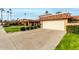 Attractive tan home with terracotta roof and a large garage at 9734 N 105Th Dr, Sun City, AZ 85351