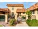 Front entrance with gated courtyard and tile roof at 9734 N 105Th Dr, Sun City, AZ 85351