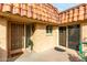 Front entrance with security door and landscaping at 9734 N 105Th Dr, Sun City, AZ 85351