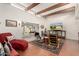 Living room with high ceilings, wood beams, and tiled floors at 9734 N 105Th Dr, Sun City, AZ 85351