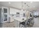 Bright eat-in kitchen boasts a center island with pendant lighting and stainless steel appliances at 12527 W Sierra Vista Ct, Glendale, AZ 85307