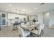 Open floor plan with an eat-in kitchen featuring modern stainless steel appliances, island seating and dining area at 12527 W Sierra Vista Ct, Glendale, AZ 85307