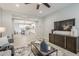 Bright and airy living room with an open layout to the kitchen and modern decor at 12527 W Sierra Vista Ct, Glendale, AZ 85307