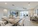 Open concept living and dining area with sliding glass doors to outdoor living space at 12527 W Sierra Vista Ct, Glendale, AZ 85307