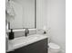 Contemporary powder room with marble countertop and sleek sink at 12808 E Harper Dr, Scottsdale, AZ 85255