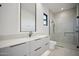 Modern bathroom with a large shower and floating vanity at 12808 E Harper Dr, Scottsdale, AZ 85255