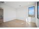 Bright bedroom with large window and hardwood floors at 12808 E Harper Dr, Scottsdale, AZ 85255