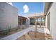 Private courtyard with desert plants and seating area at 12808 E Harper Dr, Scottsdale, AZ 85255