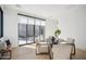 Small dining area with round table and four chairs near sliding glass doors at 12808 E Harper Dr, Scottsdale, AZ 85255