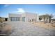 Single-story home with modern garage door and desert landscaping at 12808 E Harper Dr, Scottsdale, AZ 85255