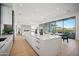 Modern kitchen with marble countertops, island, and views to backyard at 12808 E Harper Dr, Scottsdale, AZ 85255