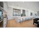 Modern kitchen with island, white cabinets, and marble countertops at 12808 E Harper Dr, Scottsdale, AZ 85255