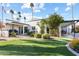 Landscaped backyard with putting green and partial view of the pool at 144 E Boca Raton Rd, Phoenix, AZ 85022