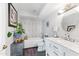 Bathroom with soaking tub, marble vanity, and modern fixtures at 144 E Boca Raton Rd, Phoenix, AZ 85022