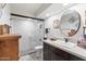 Modern bathroom with subway tile, walk-in shower, and floating vanity at 144 E Boca Raton Rd, Phoenix, AZ 85022