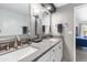 Double vanity bathroom with grey countertops and a view of bedroom at 144 E Boca Raton Rd, Phoenix, AZ 85022