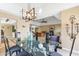 Elegant dining room with glass table and modern chandelier at 144 E Boca Raton Rd, Phoenix, AZ 85022