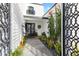 Elegant entryway with a courtyard and lush greenery at 144 E Boca Raton Rd, Phoenix, AZ 85022