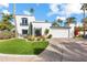 Modern two-story home with a landscaped yard and palm trees at 144 E Boca Raton Rd, Phoenix, AZ 85022