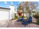 Relaxing front yard with two blue chairs and red flowers at 144 E Boca Raton Rd, Phoenix, AZ 85022