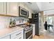 Modern kitchen with stainless steel appliances and white cabinets at 144 E Boca Raton Rd, Phoenix, AZ 85022