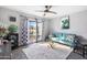 Cozy living room featuring a teal sofa and large window at 144 E Boca Raton Rd, Phoenix, AZ 85022