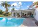 Bright and sunny view of the kidney-shaped pool and patio area at 144 E Boca Raton Rd, Phoenix, AZ 85022