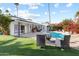 Poolside patio with fire pit and lush landscaping at 144 E Boca Raton Rd, Phoenix, AZ 85022