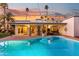 Evening view of the kidney-shaped pool and patio area at 144 E Boca Raton Rd, Phoenix, AZ 85022