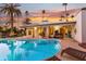 Stunning sunset view over the kidney-shaped pool and patio area at 144 E Boca Raton Rd, Phoenix, AZ 85022