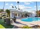 Relaxing poolside view with fire pit and patio seating at 144 E Boca Raton Rd, Phoenix, AZ 85022