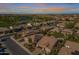 Aerial view of single story home with solar panels and desert landscaping at 1620 E Azafran Trl, Queen Creek, AZ 85140