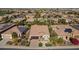 Aerial view of single story home with solar panels and desert landscaping at 1620 E Azafran Trl, Queen Creek, AZ 85140