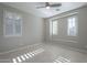 Bright bedroom with plantation shutters and tile flooring at 1620 E Azafran Trl, Queen Creek, AZ 85140