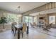 Bright dining room with sliding doors leading to a covered patio at 1620 E Azafran Trl, Queen Creek, AZ 85140