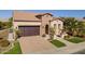 Single story home with brick accents and a 2 car garage at 1620 E Azafran Trl, Queen Creek, AZ 85140